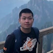 John Chen with mountain in background