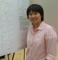 McKinny Kwok standing at a poster