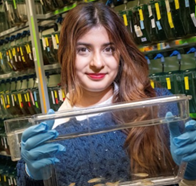 Sohini Alim holding a fishtank