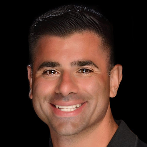 Vincent Basileo, Graphic Designer - Collateral and Web Specialist smiles at the camera