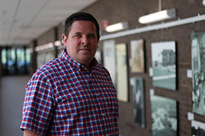 Glenn Hackett, Senior Programmer and Developer, smiling in a professional headshot
