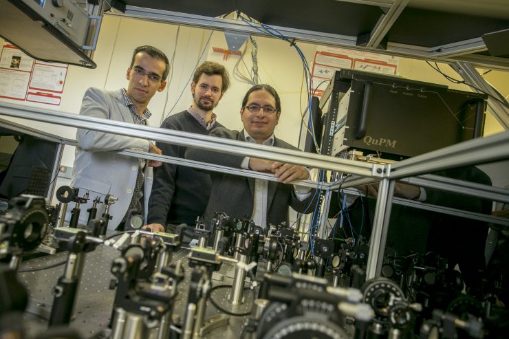 (left to right) Mehdi Namazi, Mael Flament and Eden Figueroa in their Physics & Astronomy laser lab.