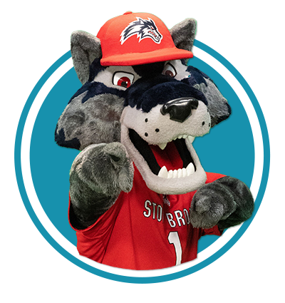 Wolfie standing in a turquoise circle and pointing toward the viewer