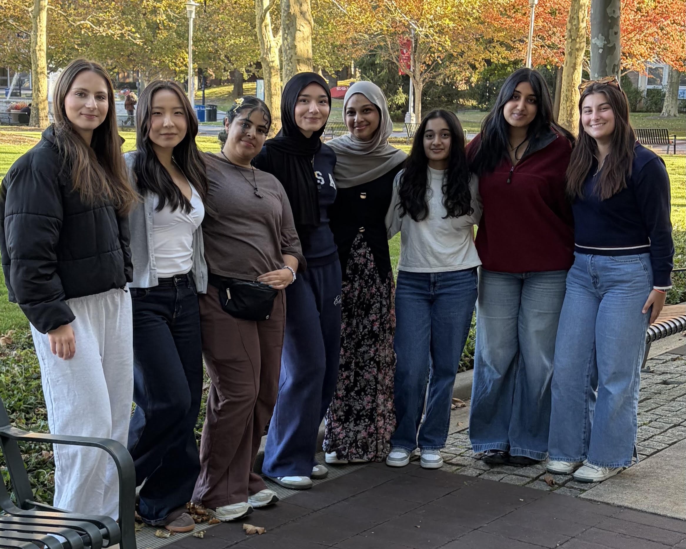 Group photo of the Stony Brook Neuroscience Axis 2026-2027 executive board standing together outdoors on campus on a fall day.