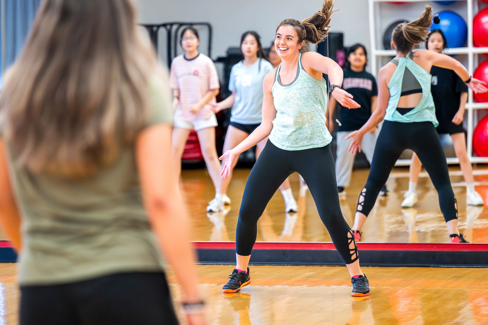 An instructor leading a fitness class.