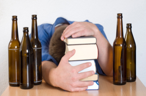 Student and empty beer bottles
