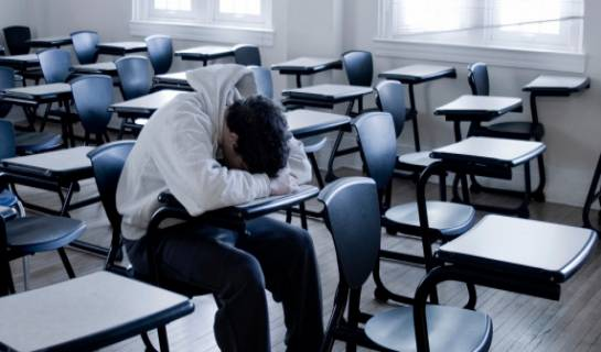 Student alone in a classroom
