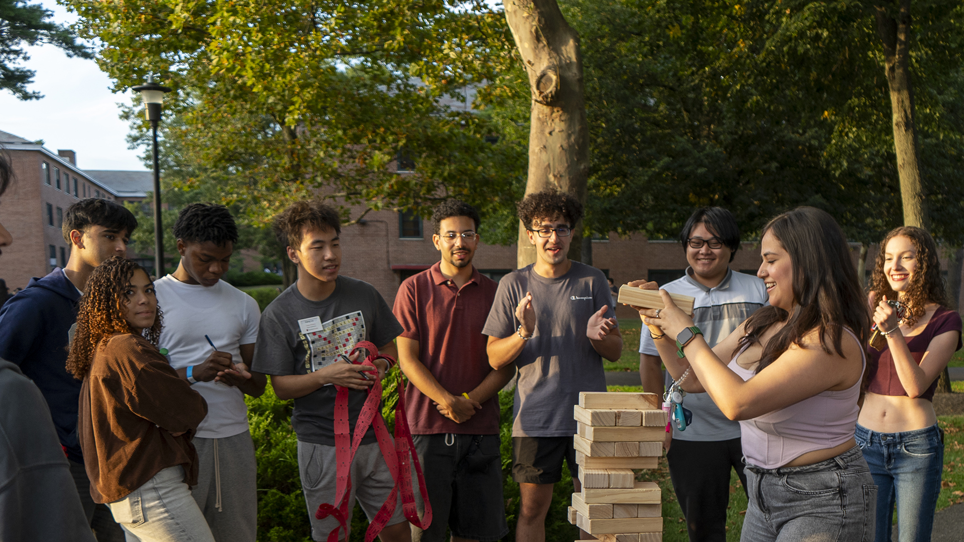 Students playing a large game of Jenga.