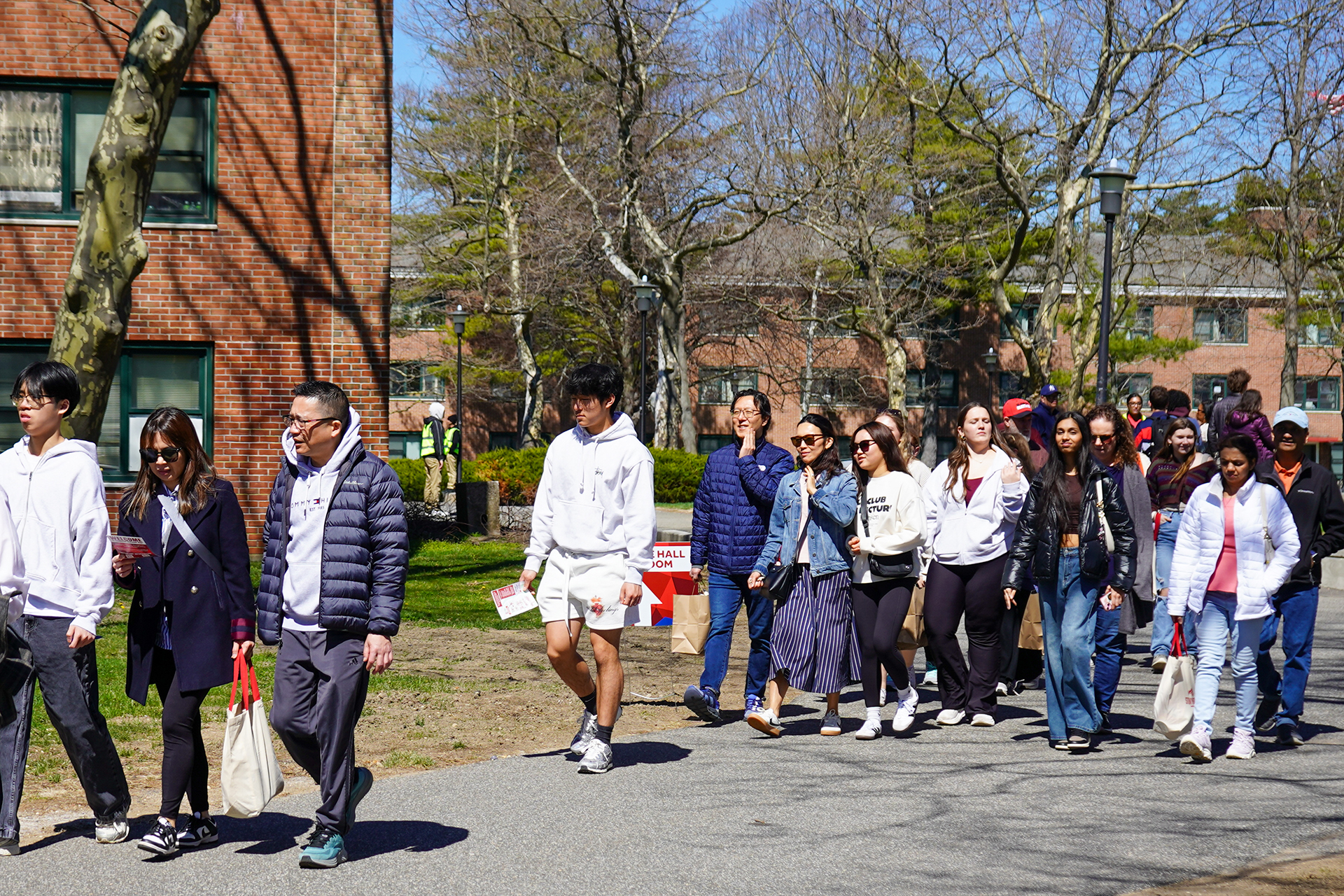 Admitted students and families walking.