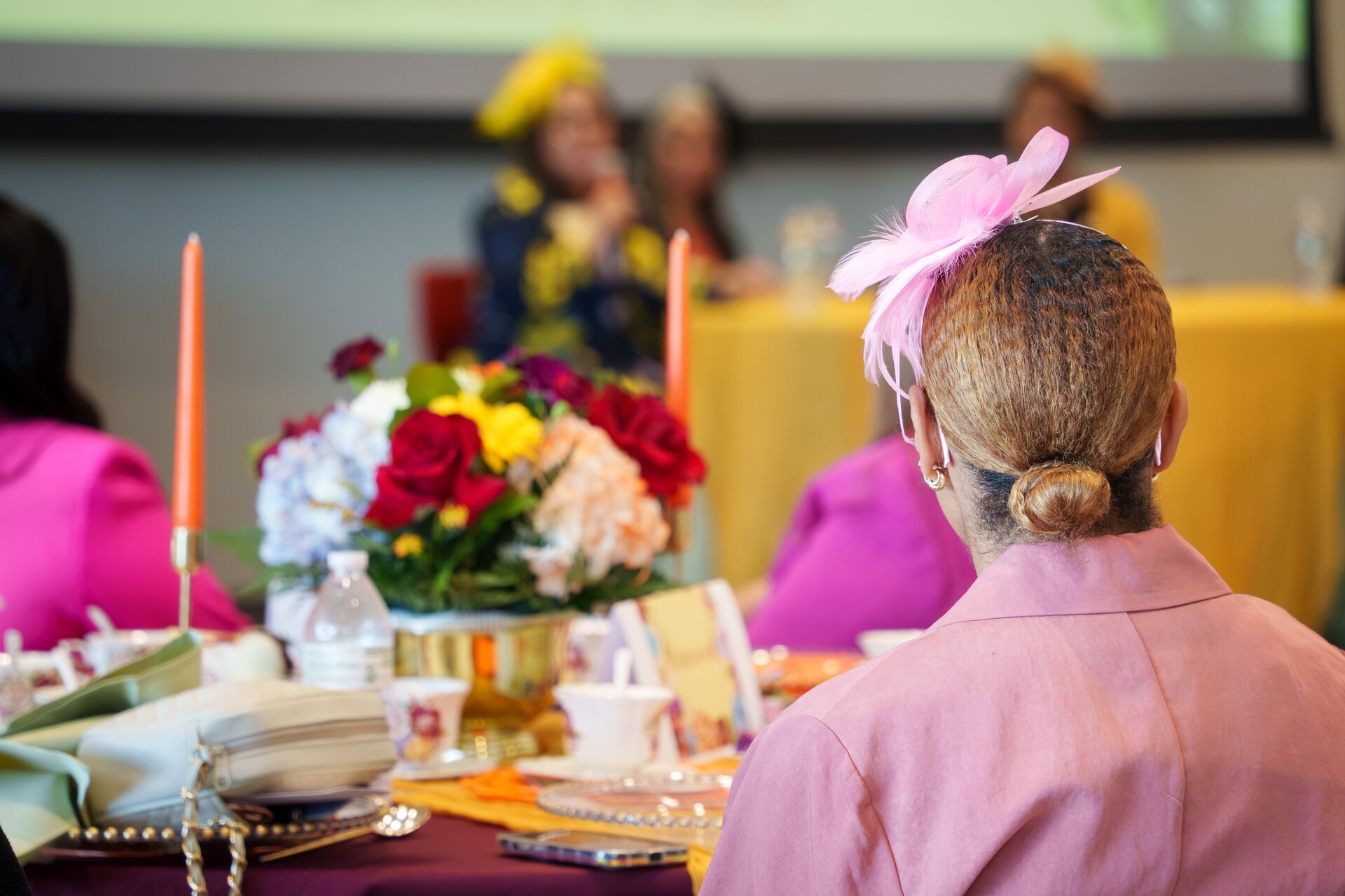 A conference participant listening to speakers
