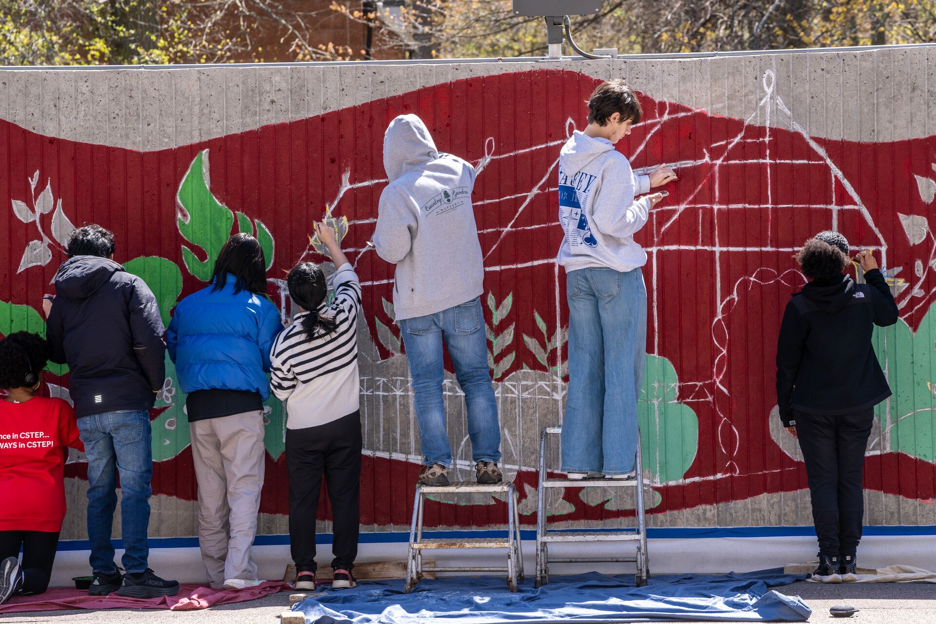 Students painting a mural.