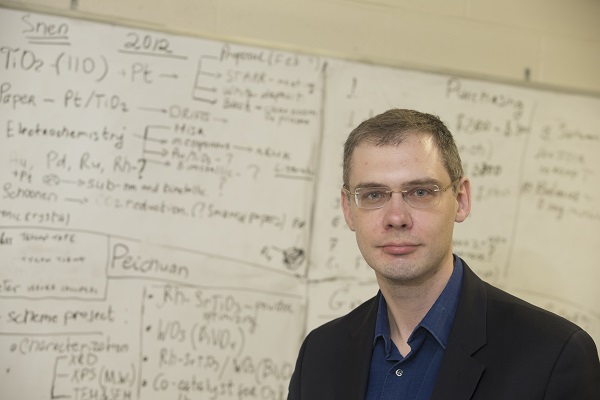 Dr. Alexander Orlov standing in front of whiteboard