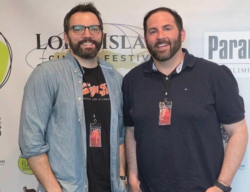 Stony Brook journalism alumni and filmmakers Ryan and Anthony Famulari pose together at a film festival event.