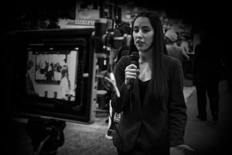 Student reporter filming a broadcast.