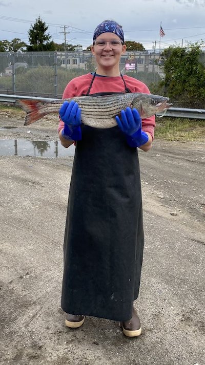Jessica Salmon holds a fish