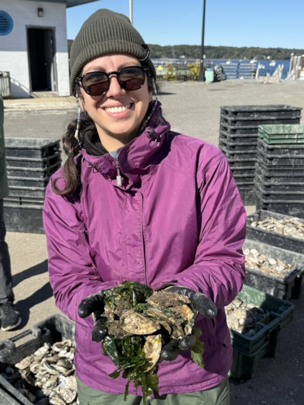 Mariana Edaes holds shellfish