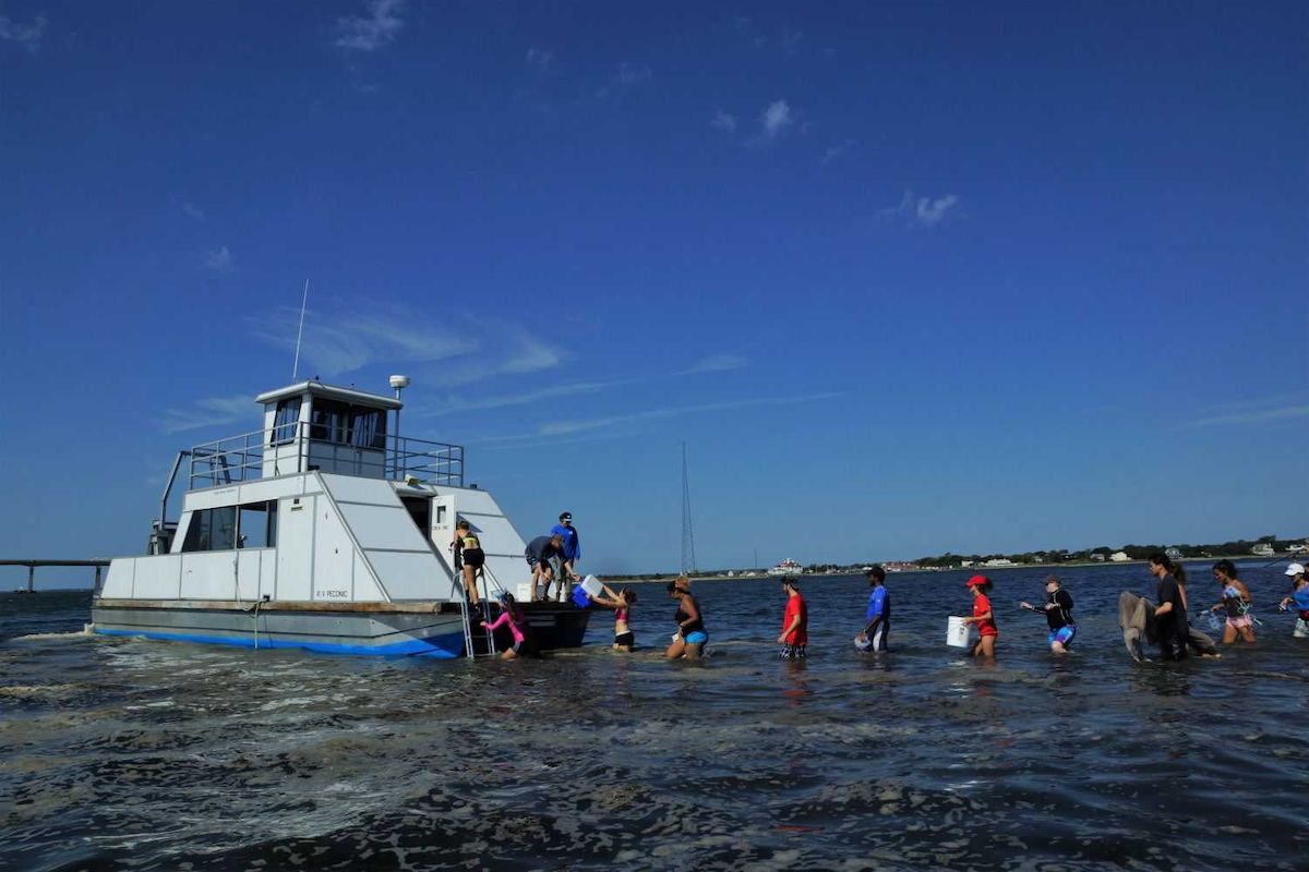 A group of students return to the Research Vessel Peconic in Shinnecock Bay