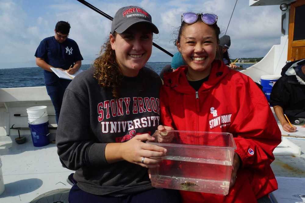 Students show off what they caught onboard the Research Vessel Paumanok