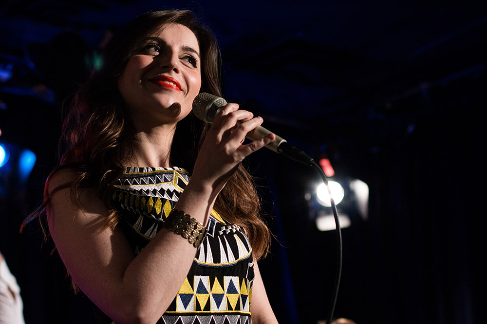 Chiara Izzi holding a microphone
