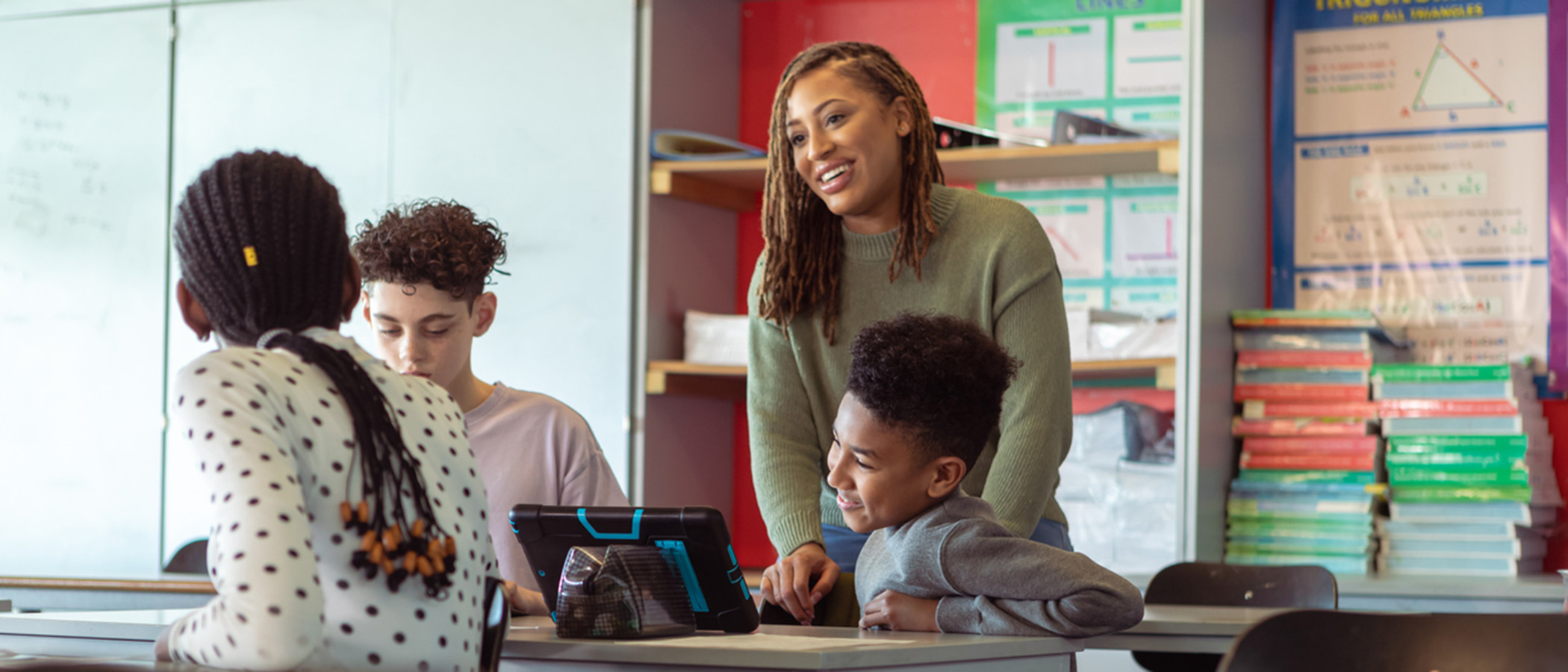 A teacher speaking in Spanish with her young students