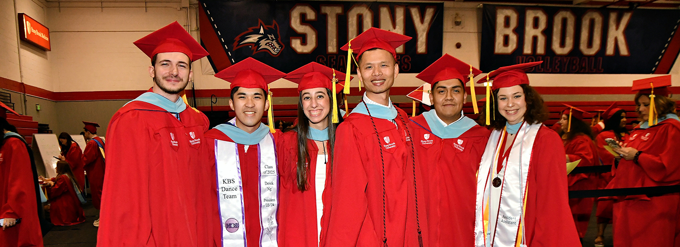 A group of smiling SPD graduates