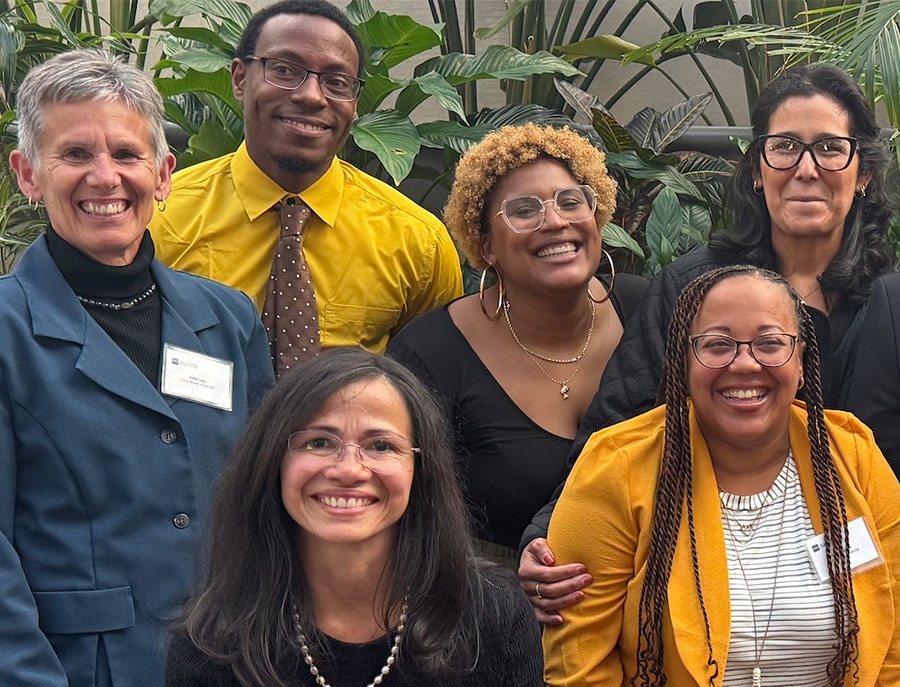 A smiling group of teachers in Stony Brook's EDL cohort