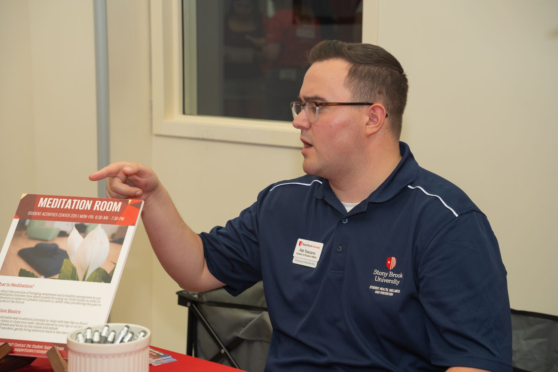 staff explaining the benefits