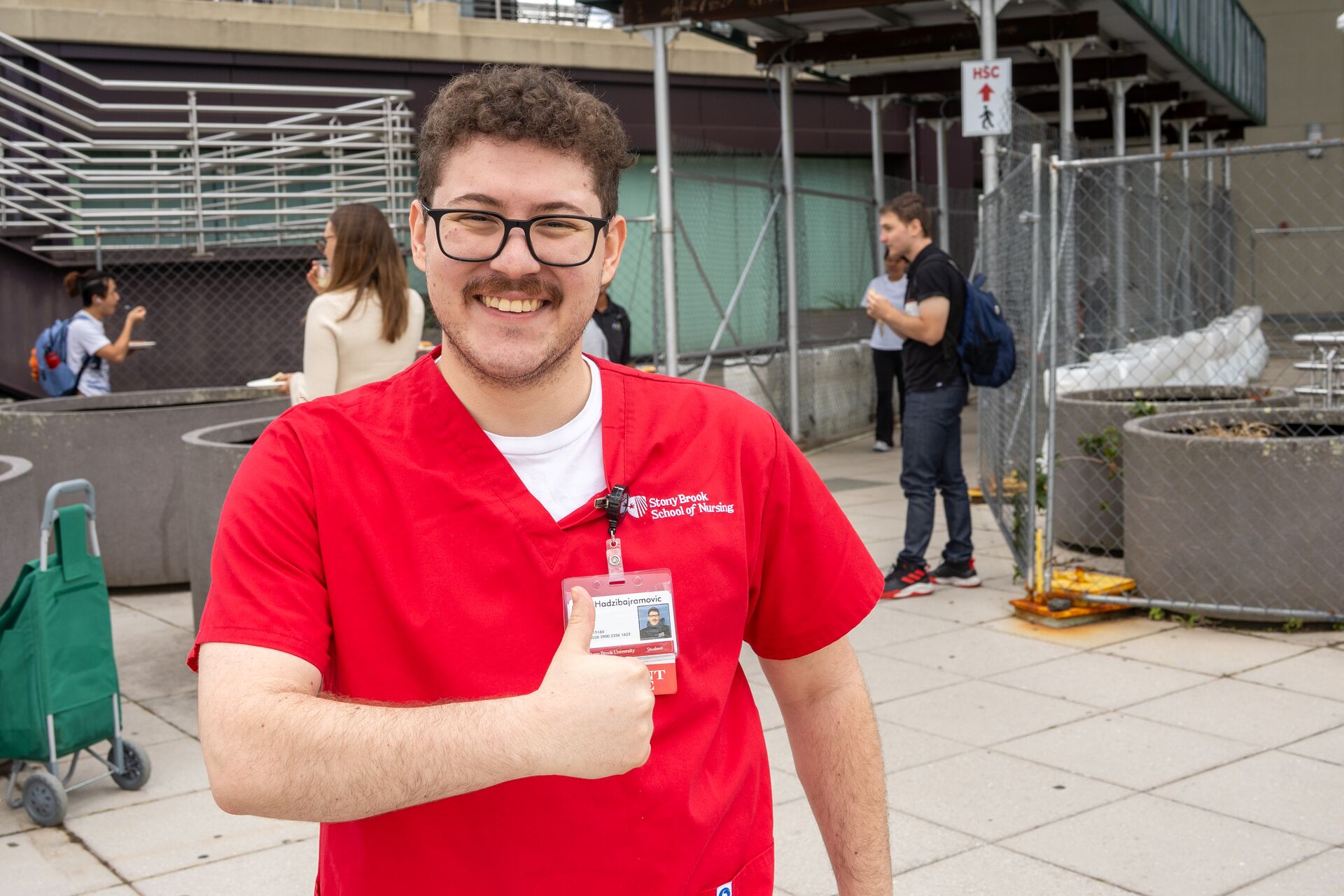sTUDENT IN RED SCRUBS