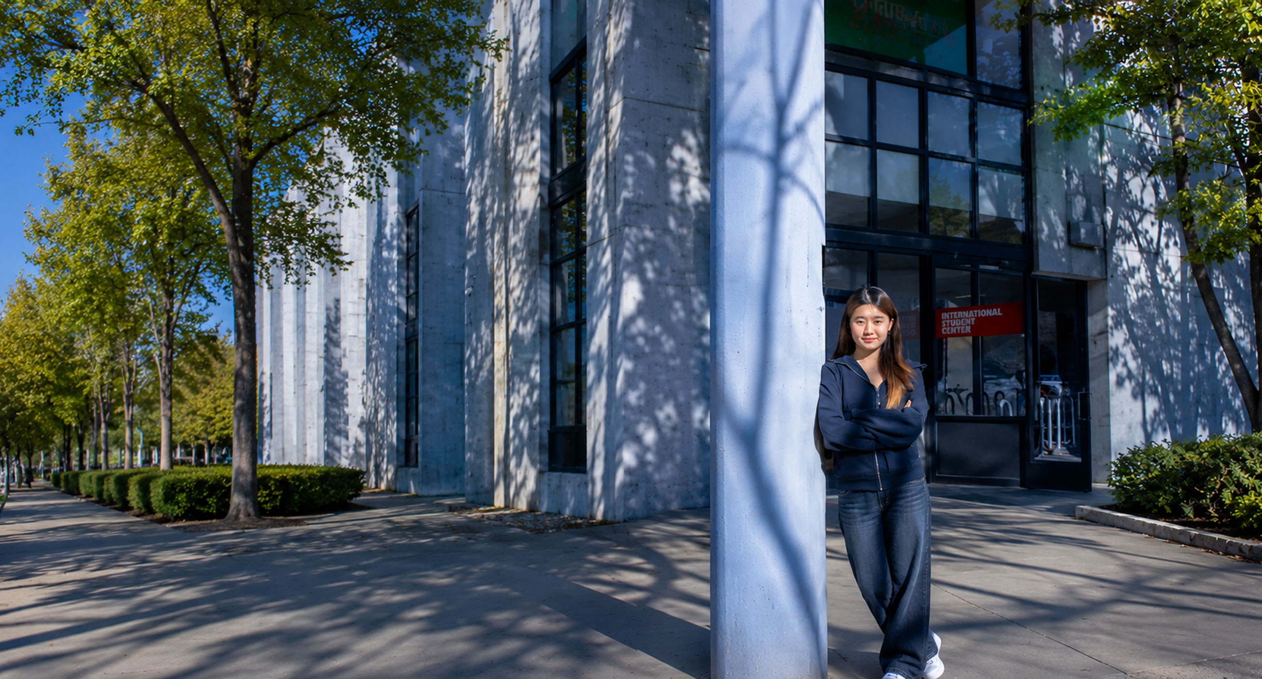 Student in front of the International Student Center